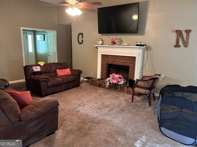 8519 Glenwoods Dr, Riverdale, GA 30274 - living area with ceiling fan, carpet, and a fireplace