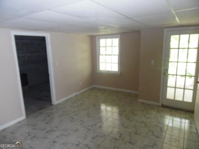 1205 Pebble Bend Dr, Grayson, GA 30017 - spare room with baseboards and marble look tile flooring