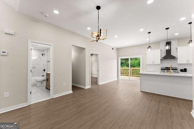 130 E Railroad Ave, Alto, GA 30510 - unfurnished living room featuring wood finished floors, a chandelier, and recessed lighting