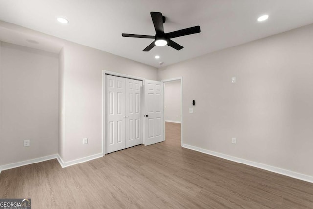 130 E Railroad Ave, Alto, GA 30510 - unfurnished bedroom with wood finished floors, recessed lighting, a closet, and a ceiling fan