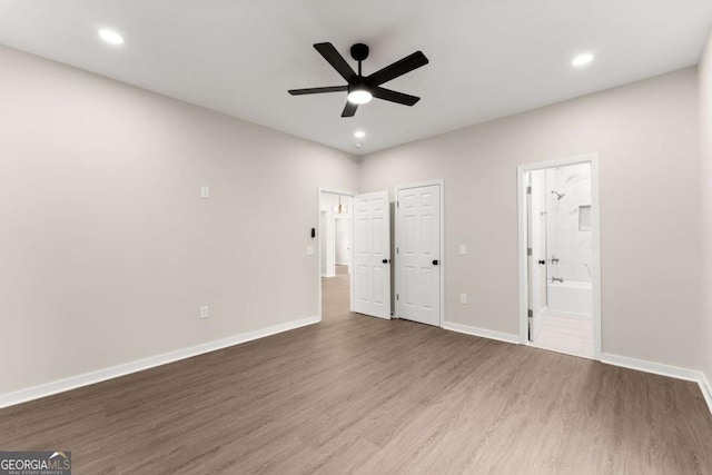 130 E Railroad Ave, Alto, GA 30510 - unfurnished bedroom featuring wood finished floors, ensuite bath, recessed lighting, and a ceiling fan