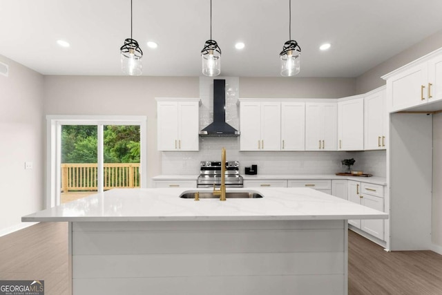 130 E Railroad Ave, Alto, GA 30510 - kitchen featuring wall chimney exhaust hood, backsplash, white cabinetry, light wood finished floors, and recessed lighting