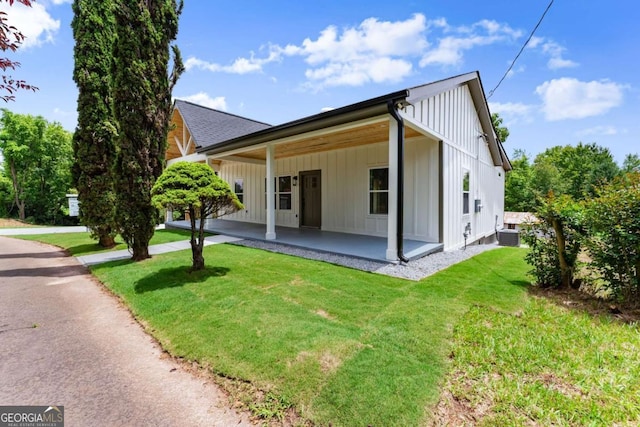 130 E Railroad Ave, Alto, GA 30510 - rear view of house featuring a lawn and board and batten siding