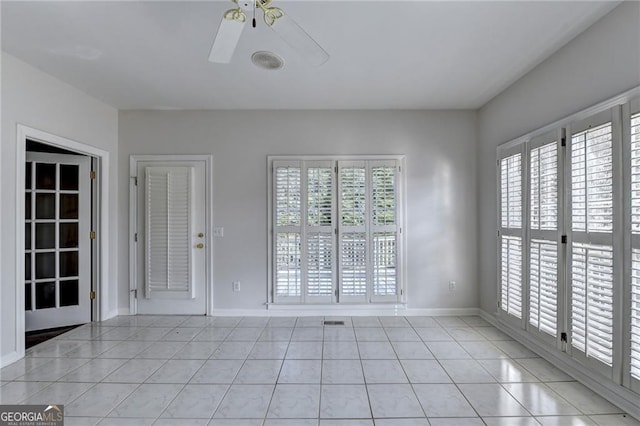 2324 Blackberry Ct, Snellville, GA 30078 - spare room with light tile patterned floors, plenty of natural light, and ceiling fan