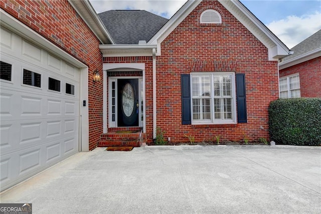 2324 Blackberry Ct, Snellville, GA 30078 - entrance to property featuring brick siding, concrete driveway, a garage, and a shingled roof