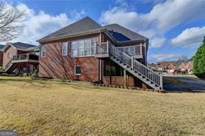 2324 Blackberry Ct, Snellville, GA 30078 - back of property featuring stairway, a wooden deck, and a yard