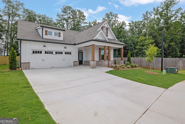 153 Alaina Rd, Holly Springs, GA 30115 - modern inspired farmhouse featuring covered porch, board and batten siding, concrete driveway, roof with shingles, and a garage