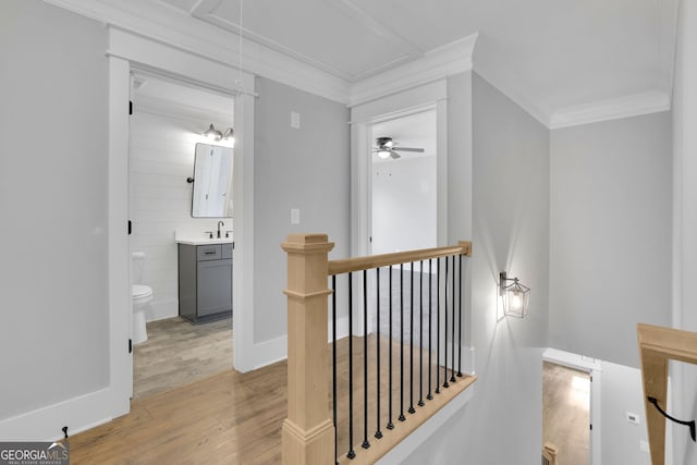153 Alaina Rd, Holly Springs, GA 30115 - corridor featuring an upstairs landing, attic access, ornamental molding, and light wood finished floors