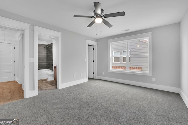 153 Alaina Rd, Holly Springs, GA 30115 - unfurnished bedroom featuring carpet floors, ensuite bathroom, and ceiling fan