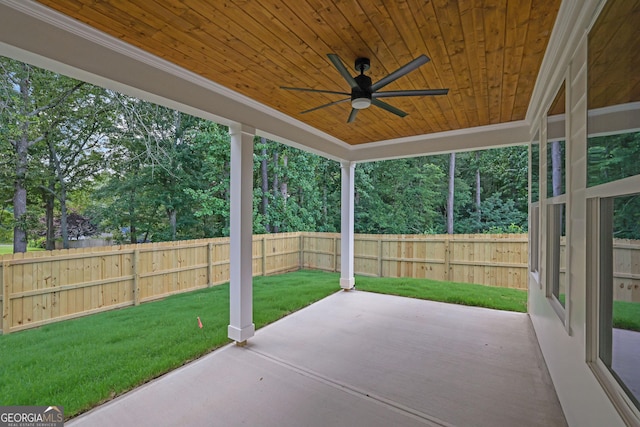 153 Alaina Rd, Holly Springs, GA 30115 - fenced backyard featuring a ceiling fan, a patio area, and view of wooded area