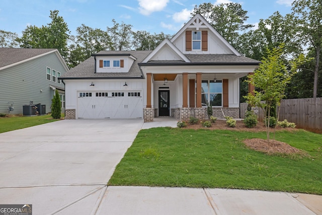 153 Alaina Rd, Holly Springs, GA 30115 - view of front of home with a garage, concrete driveway, covered porch, brick siding, and a shingled roof