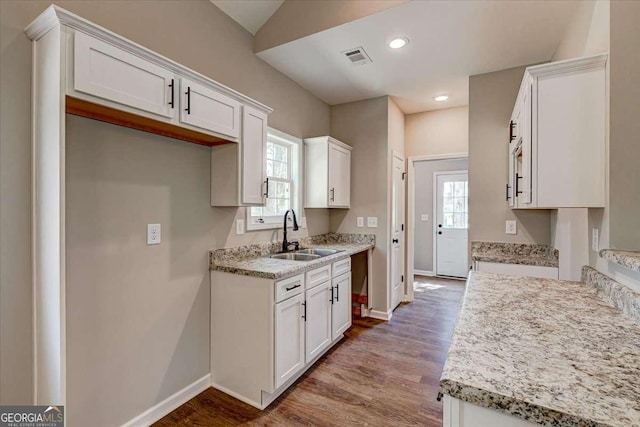 211 Loftis Rd, Temple, GA 30179 - kitchen with wood finished floors, plenty of natural light, white cabinets, and recessed lighting