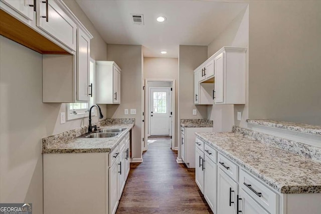 211 Loftis Rd, Temple, GA 30179 - kitchen featuring dark wood-style floors, white cabinets, recessed lighting, and light stone countertops