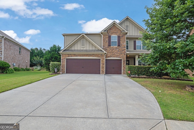 425 Eldridge Dr, Suwanee, GA 30024 - view of front facade with board and batten siding, stone siding, concrete driveway, a front yard, and an attached garage