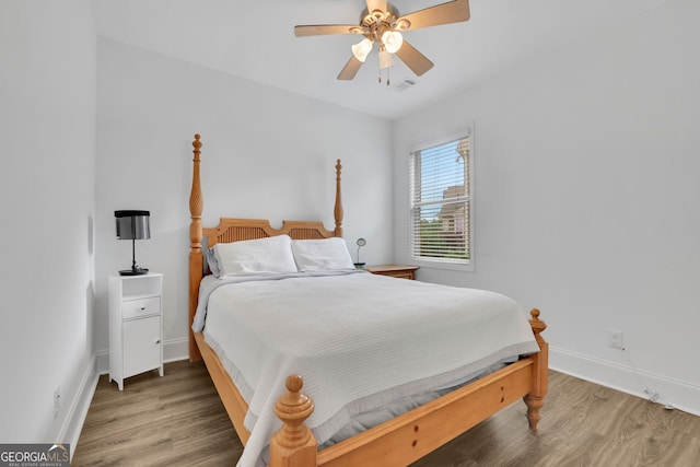 425 Eldridge Dr, Suwanee, GA 30024 - bedroom with light wood-style flooring and a ceiling fan