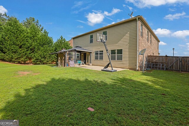 425 Eldridge Dr, Suwanee, GA 30024 - rear view of property with a gazebo, a patio, and brick siding