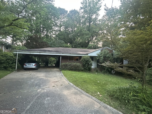 1164 Rogeretta Dr NE, Atlanta, GA 30329 - ranch-style home with driveway, a front lawn, and an attached carport