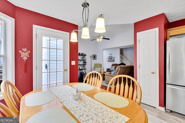52 Cherub Ln, Sharpsburg, GA 30277 - dining room with stairs, light wood-style floors, and ceiling fan