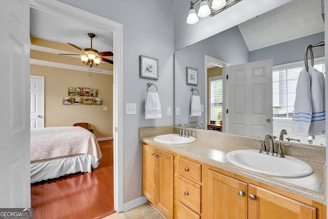 52 Cherub Ln, Sharpsburg, GA 30277 - ensuite bathroom with ceiling fan, double vanity, and wood finished floors