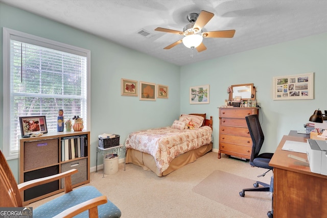 52 Cherub Ln, Sharpsburg, GA 30277 - bedroom with an office area, carpet, and a ceiling fan