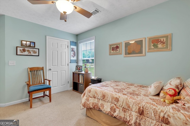52 Cherub Ln, Sharpsburg, GA 30277 - carpeted bedroom featuring a textured ceiling and ceiling fan
