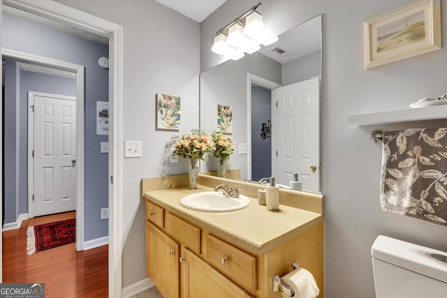 52 Cherub Ln, Sharpsburg, GA 30277 - half bath featuring wood finished floors and vanity