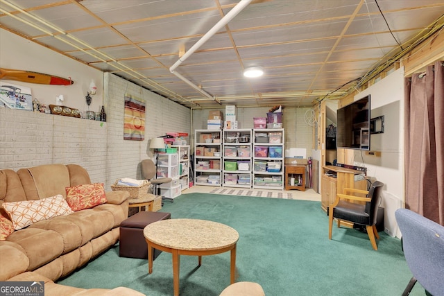 52 Cherub Ln, Sharpsburg, GA 30277 - living room featuring brick wall and carpet