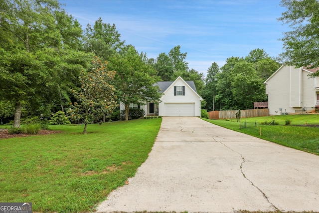 52 Cherub Ln, Sharpsburg, GA 30277 - view of front of home with a garage, driveway, and view of scattered trees
