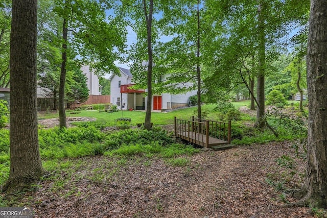 52 Cherub Ln, Sharpsburg, GA 30277 - view of green lawn with a deck