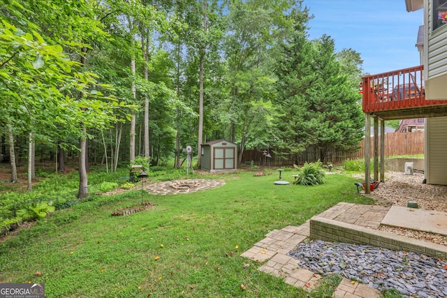 52 Cherub Ln, Sharpsburg, GA 30277 - view of yard featuring a shed and a wooden deck