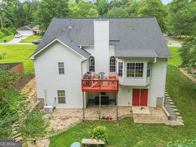 52 Cherub Ln, Sharpsburg, GA 30277 - back of property with a chimney, a deck, a lawn, a patio area, and a shingled roof