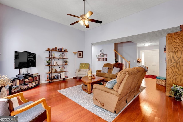 52 Cherub Ln, Sharpsburg, GA 30277 - living room with stairs, ceiling fan, and wood finished floors