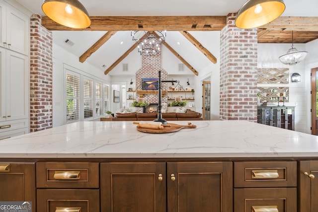 639 Frank Crook Rd, Canon, GA 30520 - kitchen with a chandelier, a center island, white cabinetry, and light stone counters