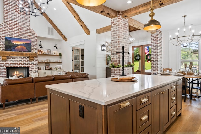 639 Frank Crook Rd, Canon, GA 30520 - kitchen featuring a chandelier, light wood-type flooring, open floor plan, a fireplace, and recessed lighting