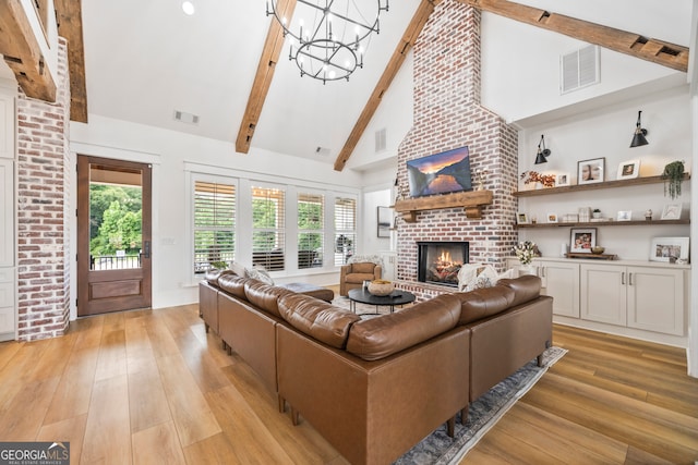 639 Frank Crook Rd, Canon, GA 30520 - living area featuring a brick fireplace, light wood finished floors, high vaulted ceiling, a chandelier, and beamed ceiling