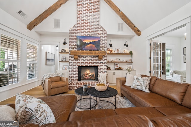639 Frank Crook Rd, Canon, GA 30520 - living room with a fireplace, wood finished floors, beamed ceiling, and high vaulted ceiling