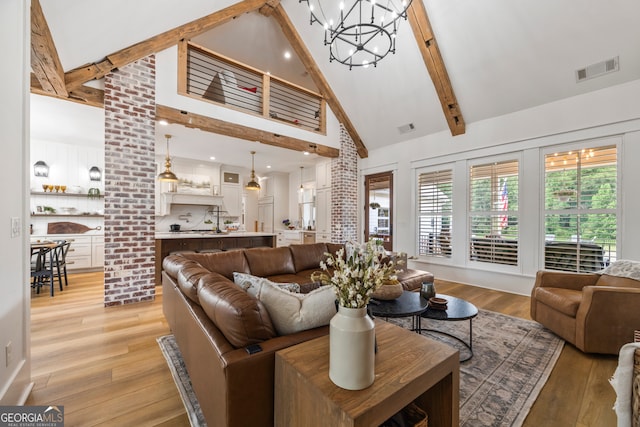 639 Frank Crook Rd, Canon, GA 30520 - living room with high vaulted ceiling, beamed ceiling, a chandelier, and light wood-type flooring