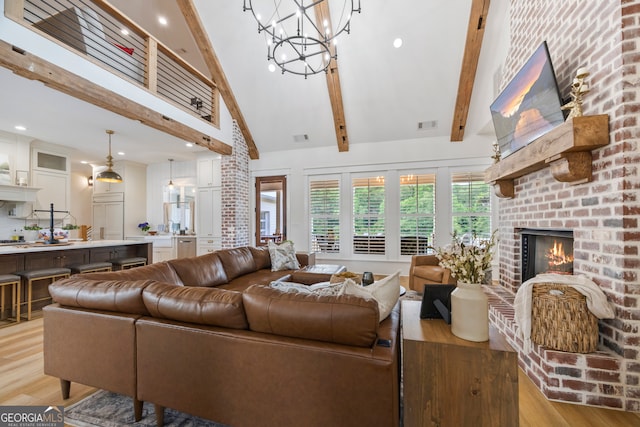 639 Frank Crook Rd, Canon, GA 30520 - living area featuring light wood finished floors, beamed ceiling, a fireplace, a chandelier, and high vaulted ceiling