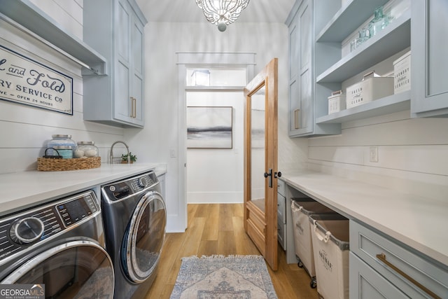 639 Frank Crook Rd, Canon, GA 30520 - laundry area with washer and dryer, cabinet space, and light wood finished floors