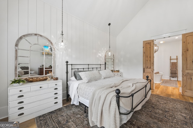639 Frank Crook Rd, Canon, GA 30520 - bedroom featuring high vaulted ceiling, wood finished floors, and connected bathroom