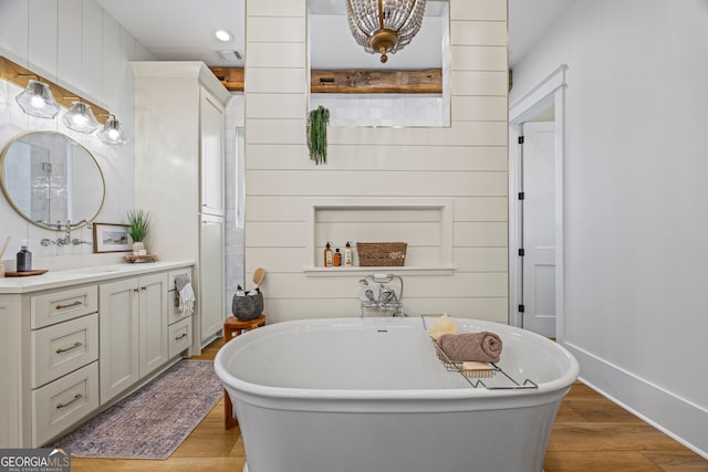 639 Frank Crook Rd, Canon, GA 30520 - bathroom with vanity, wood finished floors, a soaking tub, and recessed lighting
