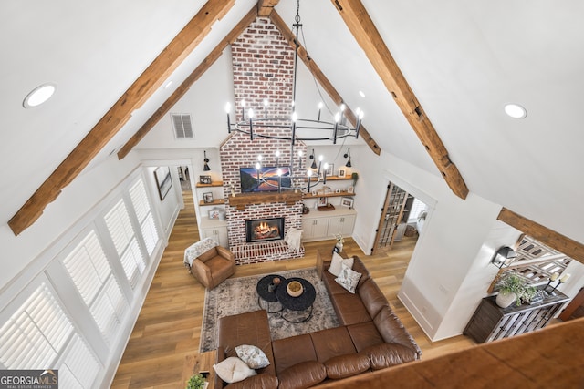 639 Frank Crook Rd, Canon, GA 30520 - living room featuring high vaulted ceiling, beam ceiling, a fireplace, a chandelier, and recessed lighting