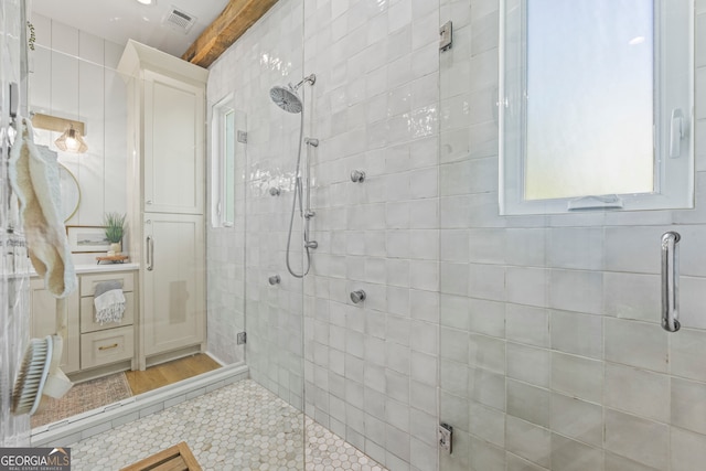 639 Frank Crook Rd, Canon, GA 30520 - bathroom featuring a stall shower, tile patterned flooring, beam ceiling, and tile walls