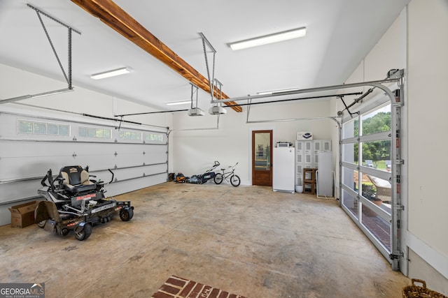 639 Frank Crook Rd, Canon, GA 30520 - garage featuring freestanding refrigerator and a garage door opener
