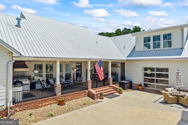 639 Frank Crook Rd, Canon, GA 30520 - view of front of house featuring a metal roof, a porch, and a patio area