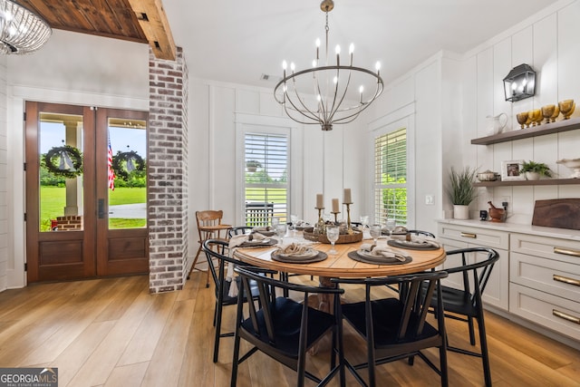 639 Frank Crook Rd, Canon, GA 30520 - dining area with a chandelier, a decorative wall, light wood-style flooring, and beam ceiling