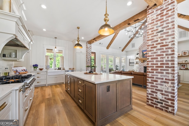 639 Frank Crook Rd, Canon, GA 30520 - kitchen featuring stainless steel gas stovetop, light wood finished floors, white cabinets, healthy amount of natural light, and recessed lighting