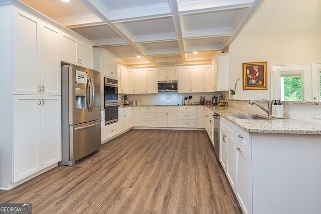40 Westbrook Rd, Carrollton, GA 30116 - kitchen with appliances with stainless steel finishes, dark wood-style flooring, white cabinetry, a peninsula, and decorative backsplash