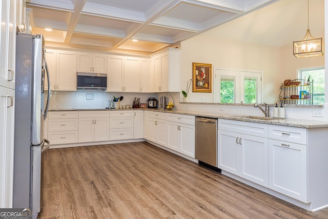 40 Westbrook Rd, Carrollton, GA 30116 - kitchen featuring stainless steel appliances, light wood-style flooring, white cabinets, beamed ceiling, and decorative backsplash