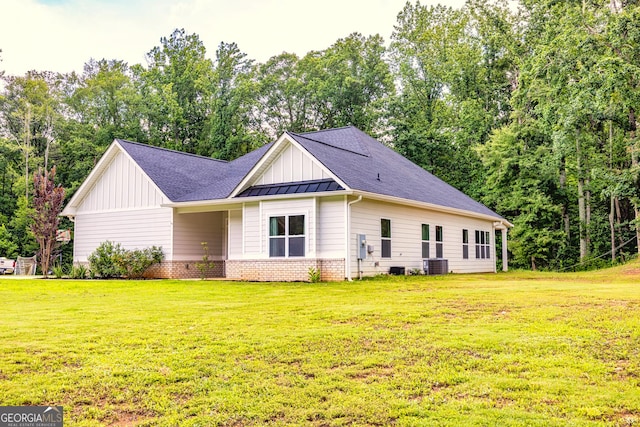 40 Westbrook Rd, Carrollton, GA 30116 - view of front of property featuring board and batten siding, a front yard, and roof with shingles